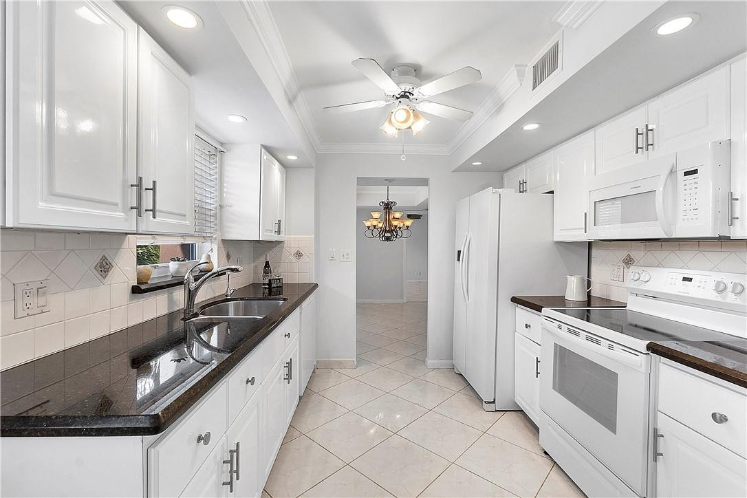 6100 Northwest 2nd Avenue, Unit 321 Boca Raton, FL 33487 - Photo 7 of 27 a kitchen with stainless steel appliances a sink stove and refrigerator