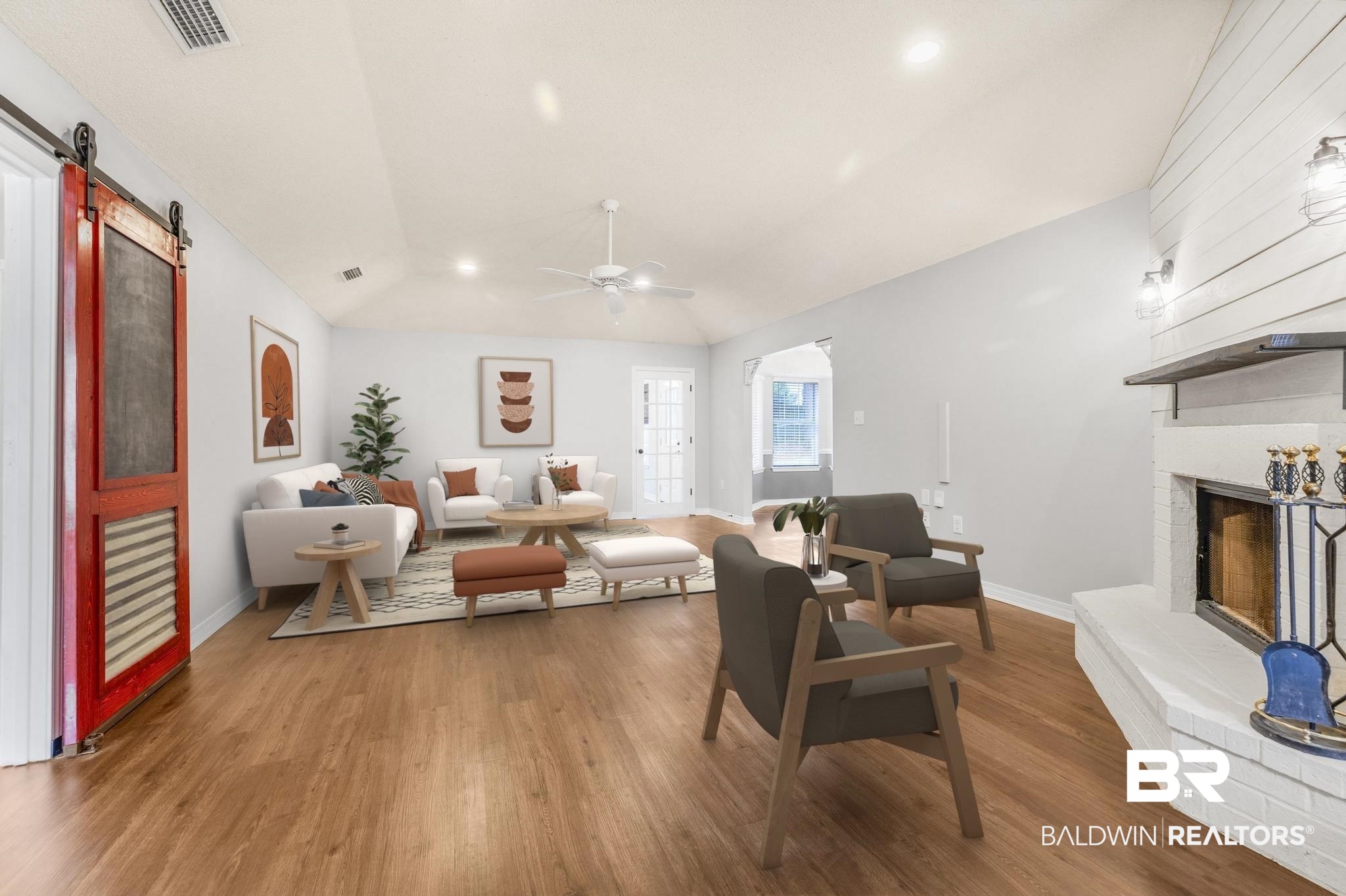 140 Hope Drive Daphne, AL 36526 - Photo 2 of 54 Living area featuring a fireplace, wood finished floors, a barn door, lofted ceiling, and ceiling fan