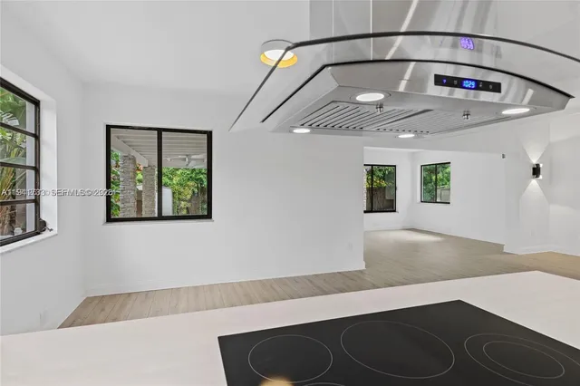 a view of staircase with a rug and a window