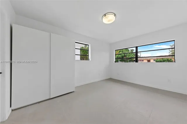 an empty room with windows