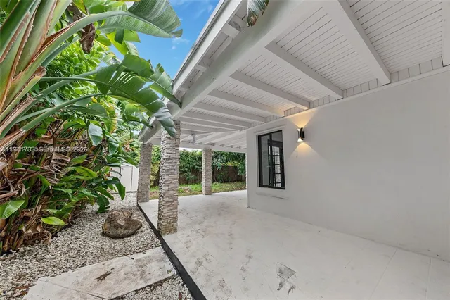 a view of a garden with patio