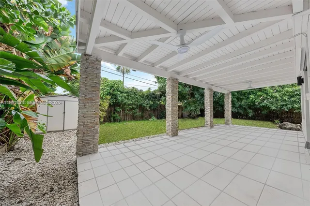 a view of a backyard of the house