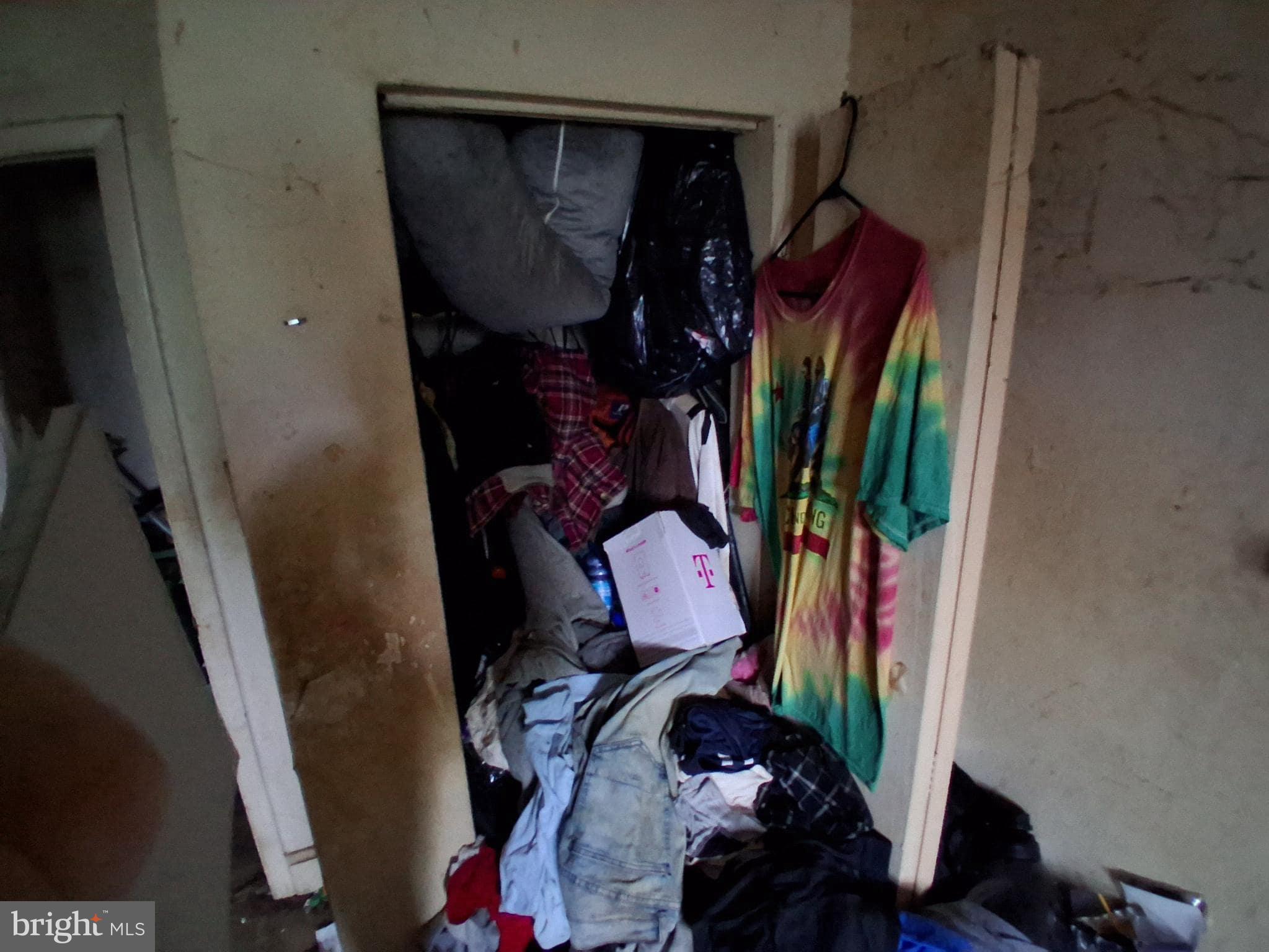 4035 Cedardale Road Baltimore, MD 21215 - Photo 19 of 40 a view of walk in closet with clothes and shoes