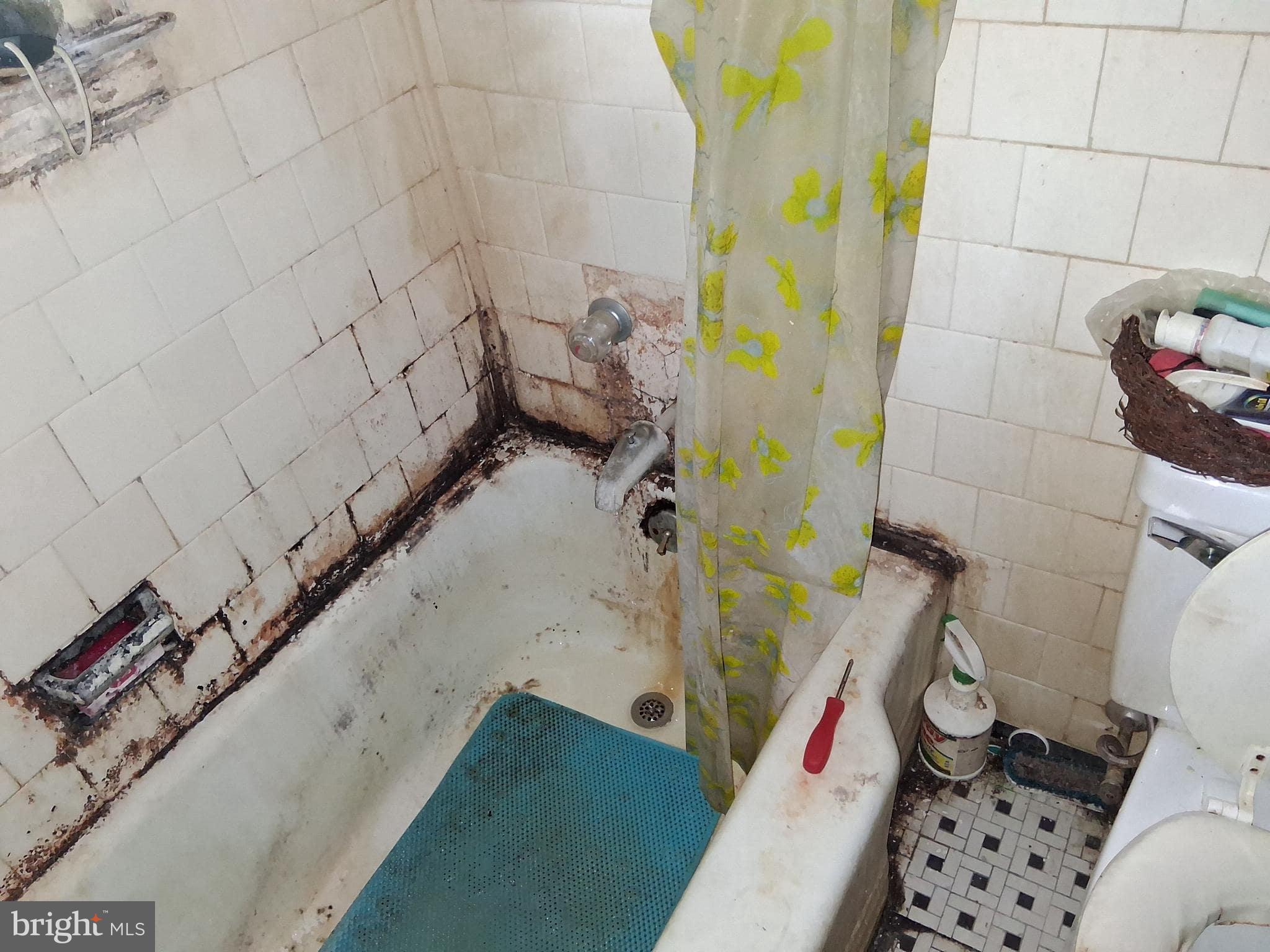 4035 Cedardale Road Baltimore, MD 21215 - Photo 27 of 40 a bathroom with a sink and toilet