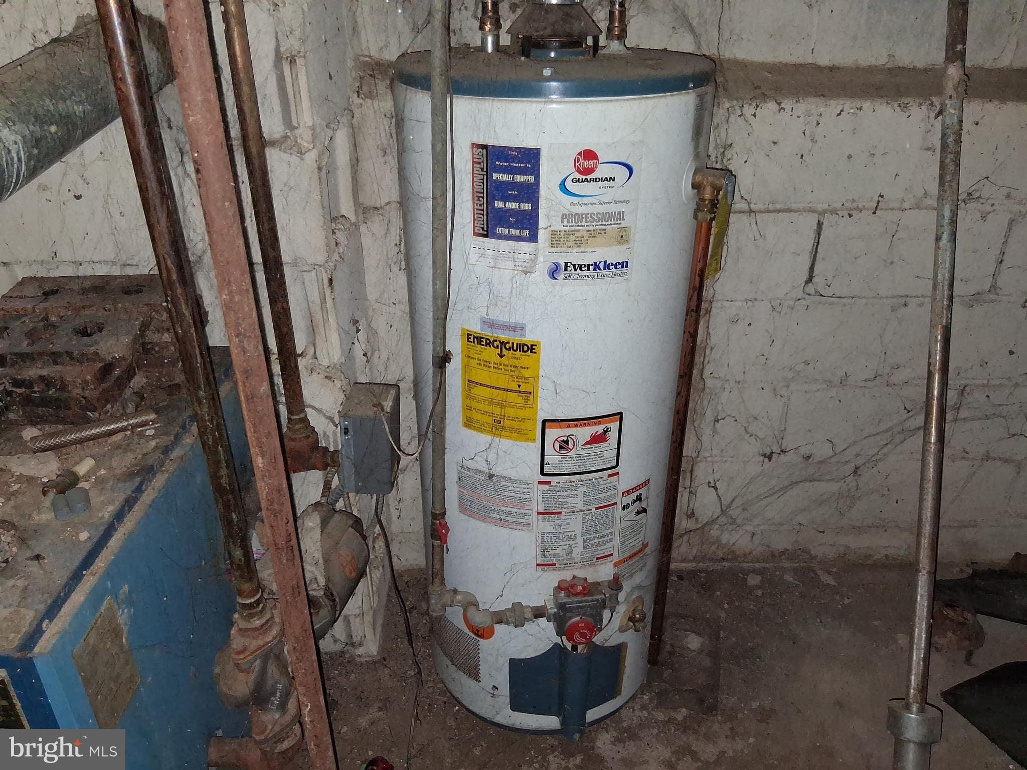 4035 Cedardale Road Baltimore, MD 21215 - Photo 33 of 40 a bathroom with a shower and a sink