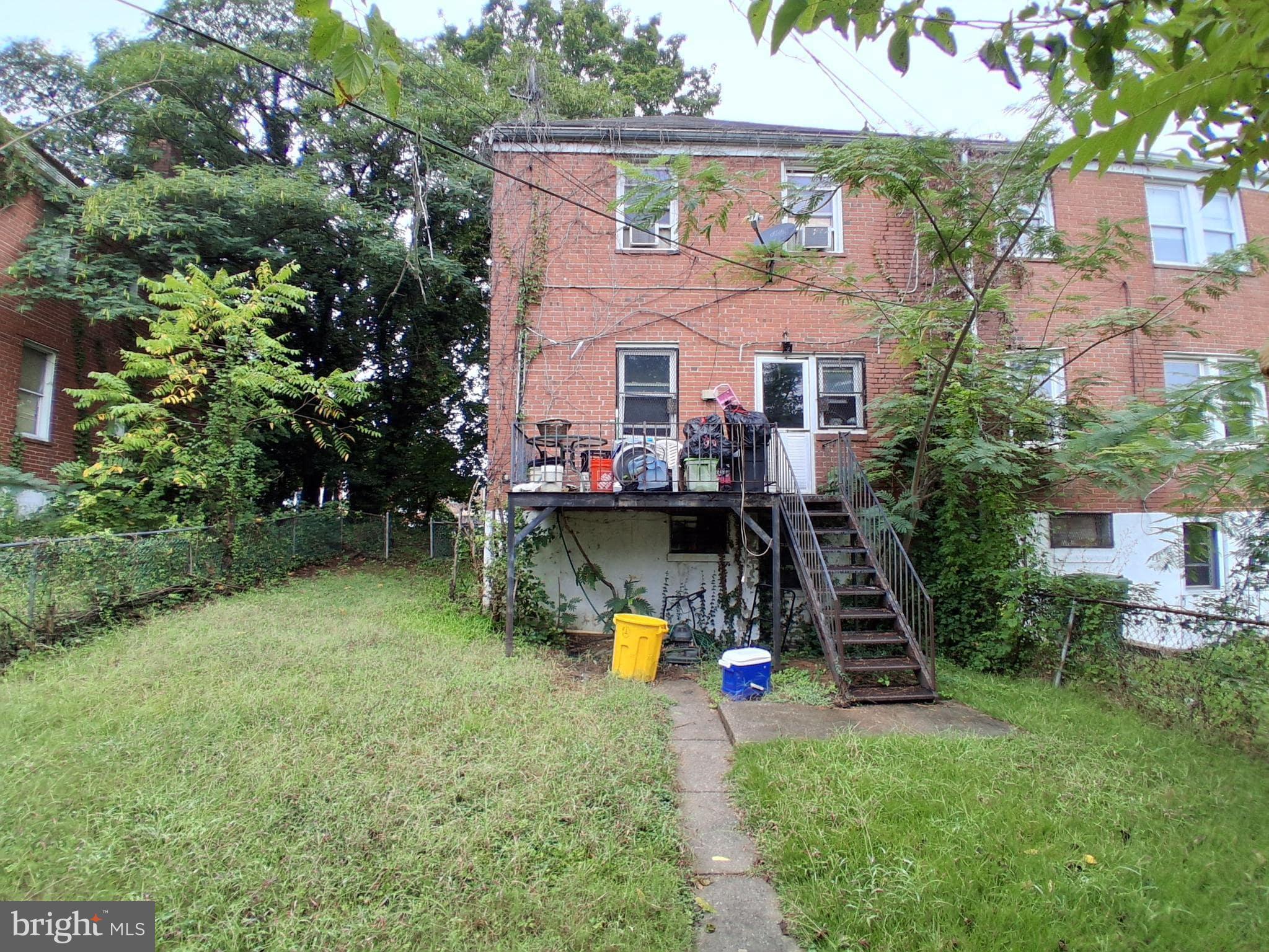 4035 Cedardale Road Baltimore, MD 21215 - Photo 38 of 40 an aerial view of a house with swimming pool a yard and a fountain