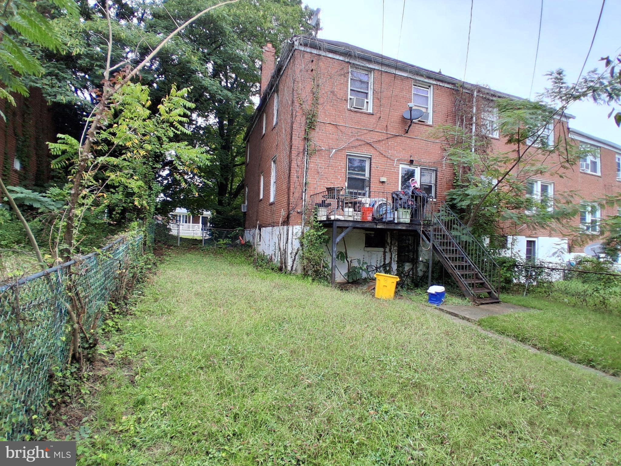 4035 Cedardale Road Baltimore, MD 21215 - Photo 39 of 40 a view of a house with a backyard and plants