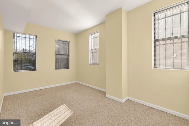 a view of empty room with windows