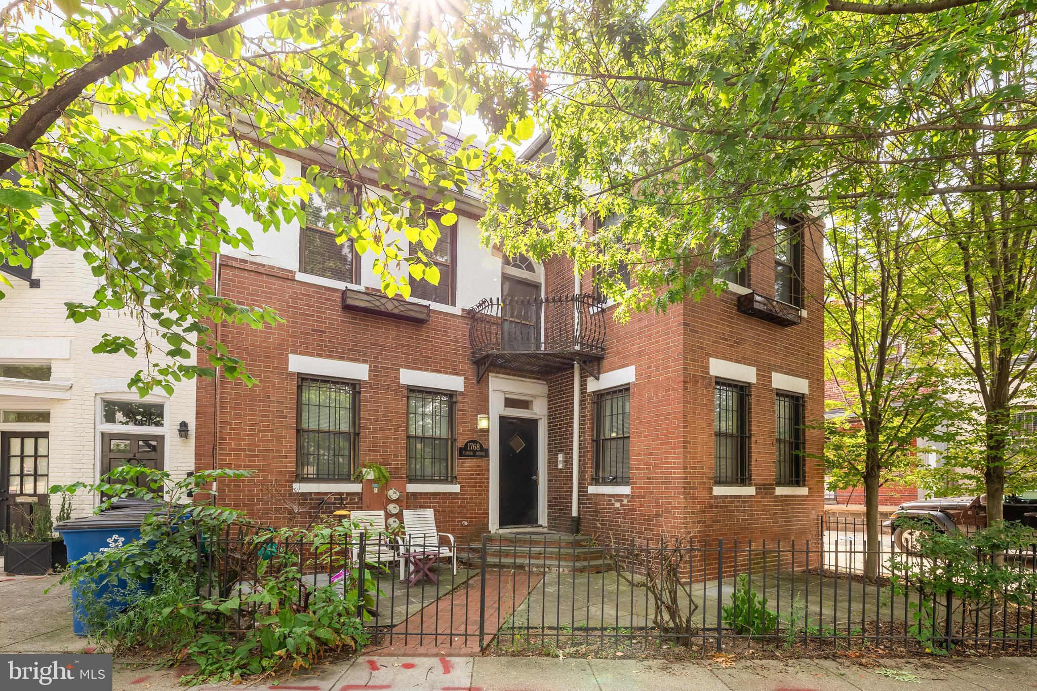 1768 Florida Avenue Northwest, Unit 1 Washington, DC 20009 - Photo 18 of 19 a front view of a house with a tree