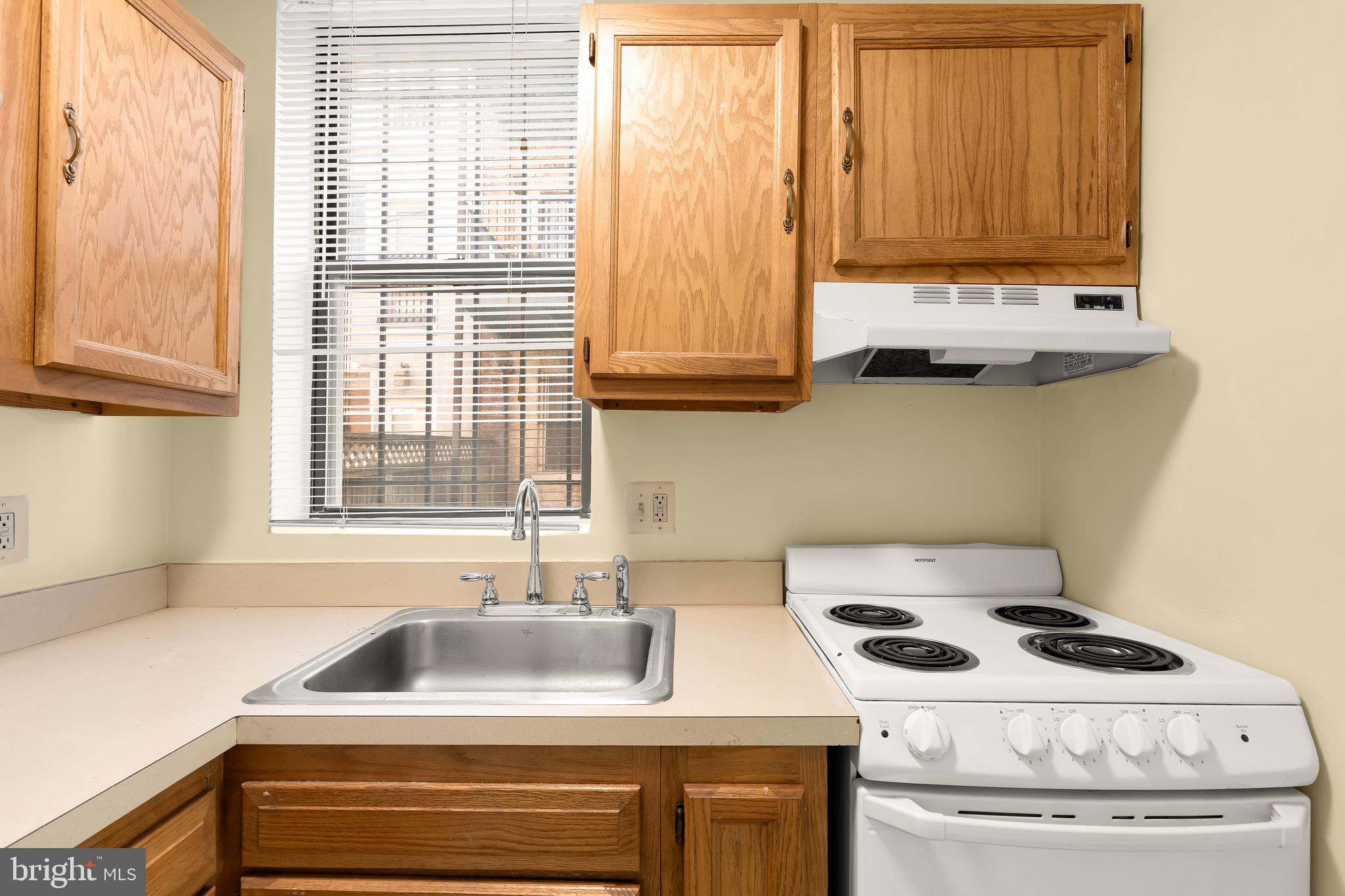 1768 Florida Avenue Northwest, Unit 1 Washington, DC 20009 - Photo 10 of 19 a kitchen with a stove and a sink