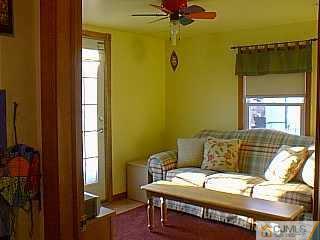 10 Fox Road Edison, NJ 08817 - Photo 3 of 8 a bedroom with a bed and a window