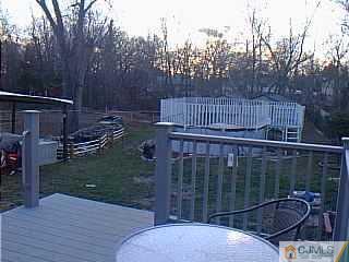10 Fox Road Edison, NJ 08817 - Photo 7 of 8 a view of a balcony with a swing