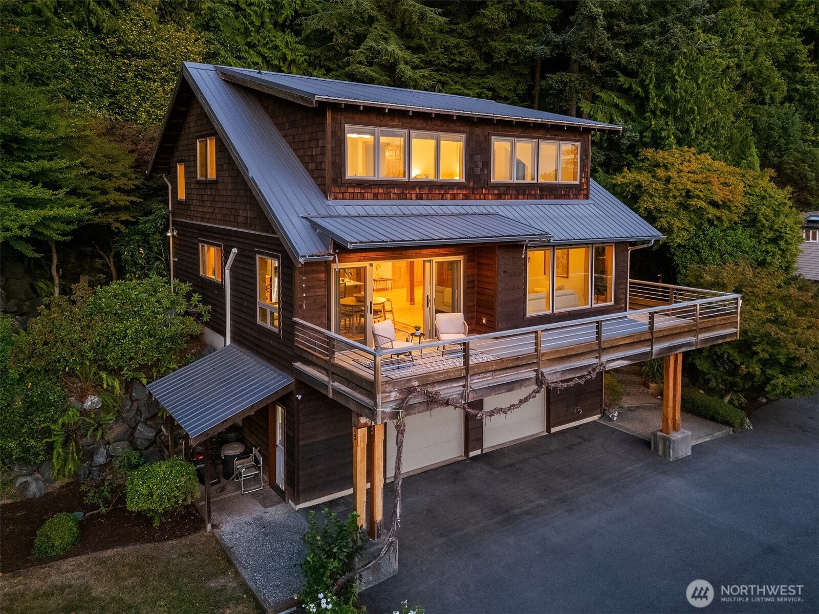1002 Chuckanut Drive Bellingham, WA 98229 - Photo 2 of 40 a backyard of a house with wooden floor and outdoor seating