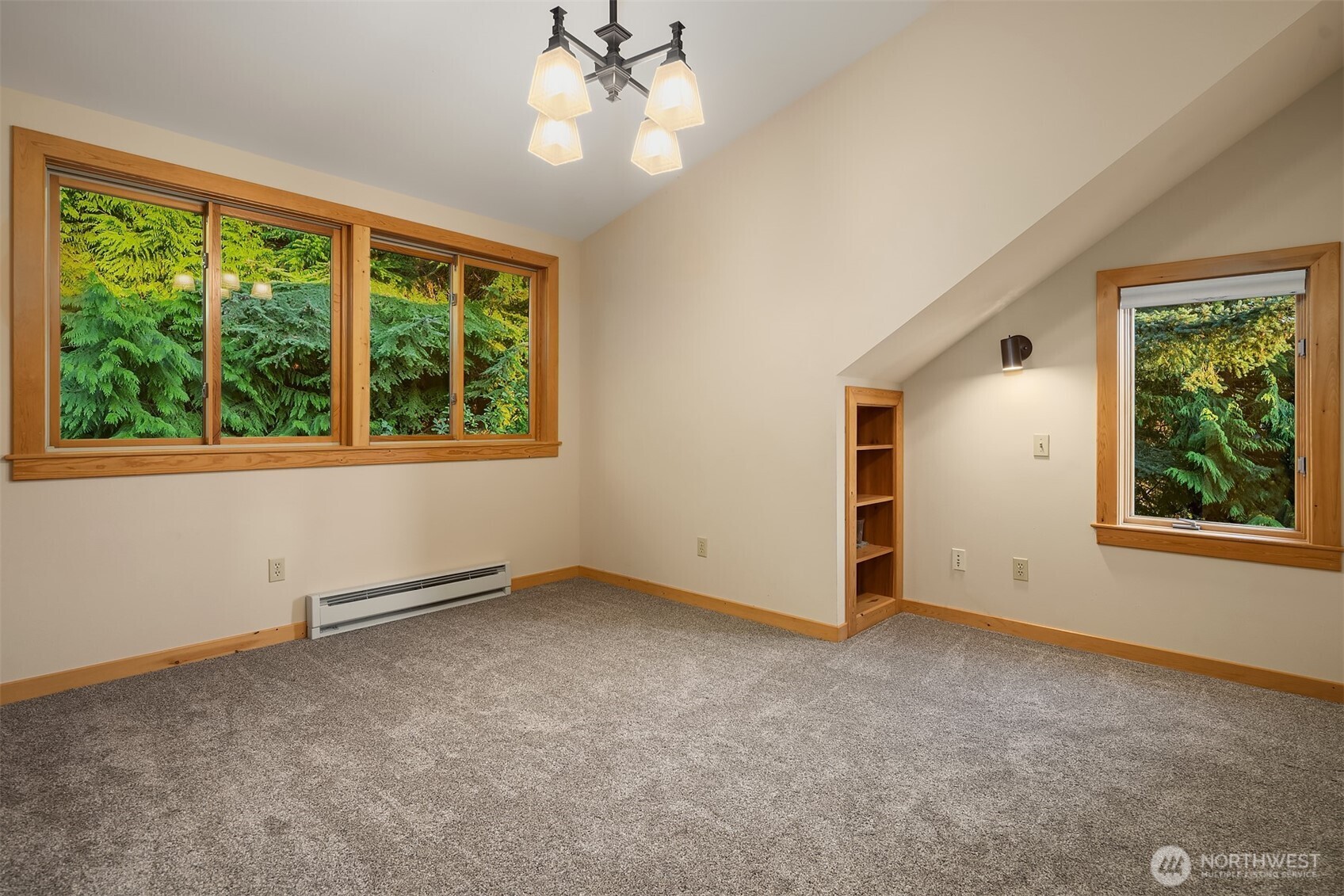 1002 Chuckanut Drive Bellingham, WA 98229 - Photo 21 of 40 an empty room with windows and chandelier fan