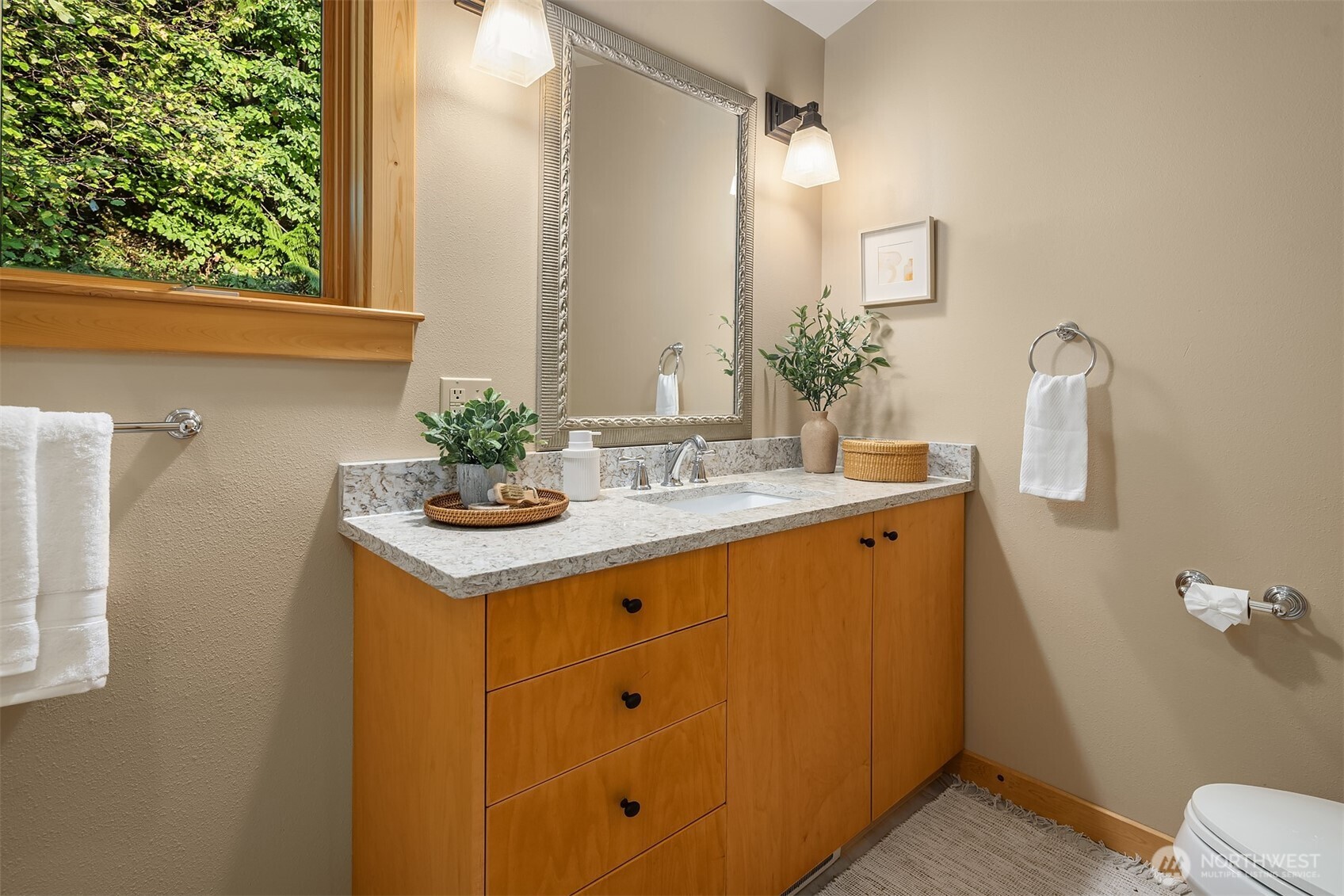 1002 Chuckanut Drive Bellingham, WA 98229 - Photo 23 of 40 a bathroom with a sink a toilet and mirror