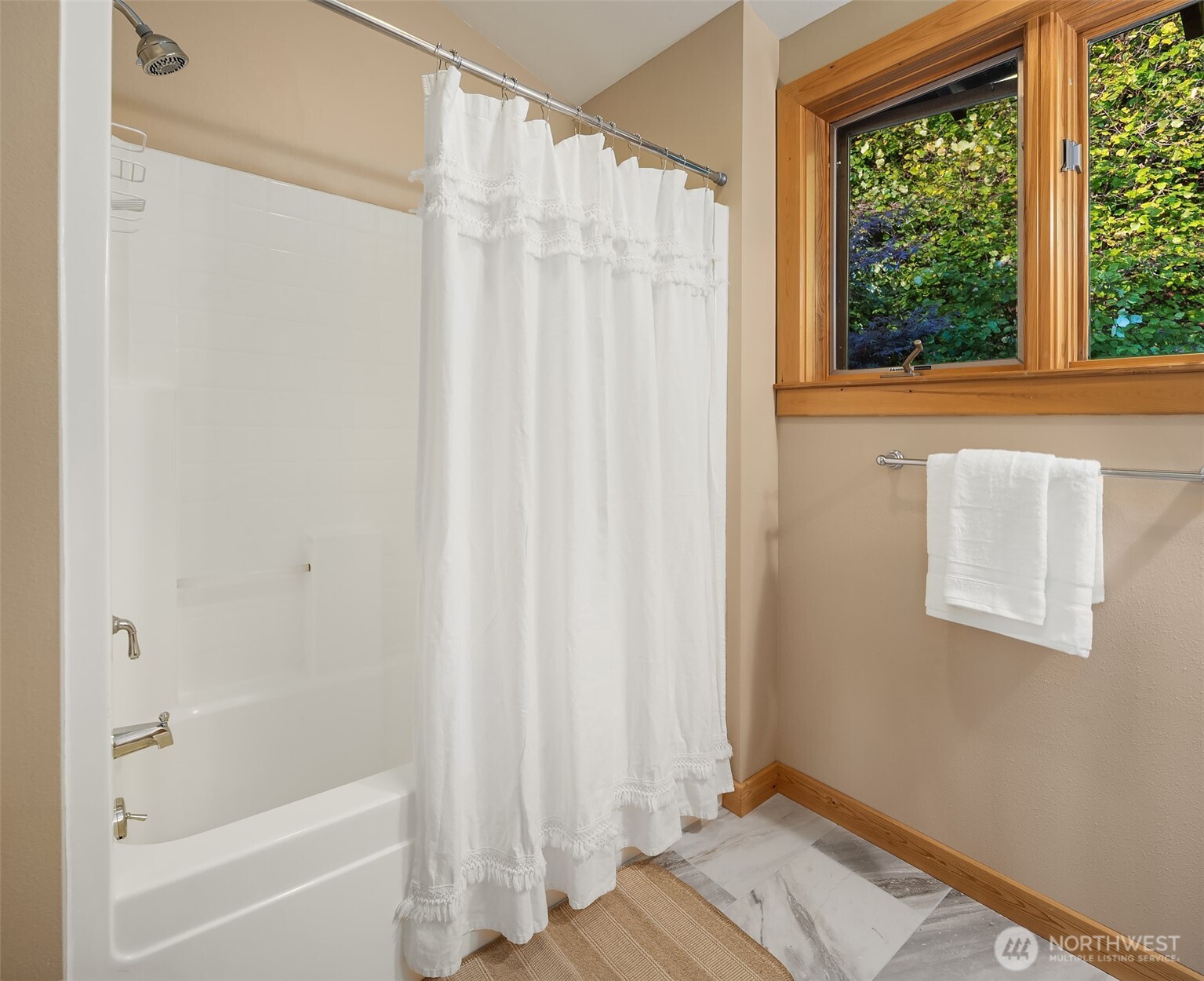 1002 Chuckanut Drive Bellingham, WA 98229 - Photo 24 of 40 a bathroom with a window and a shower