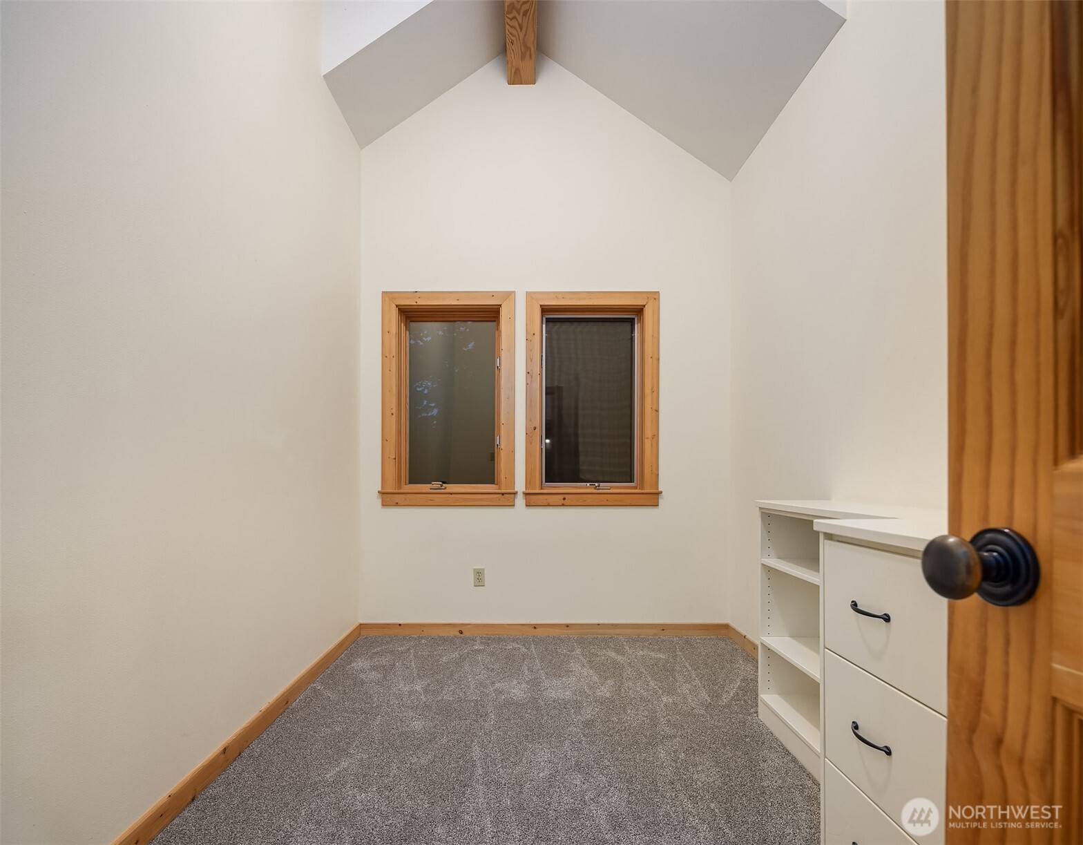 1002 Chuckanut Drive Bellingham, WA 98229 - Photo 27 of 40 a view of an empty room with wooden floor and cabinets