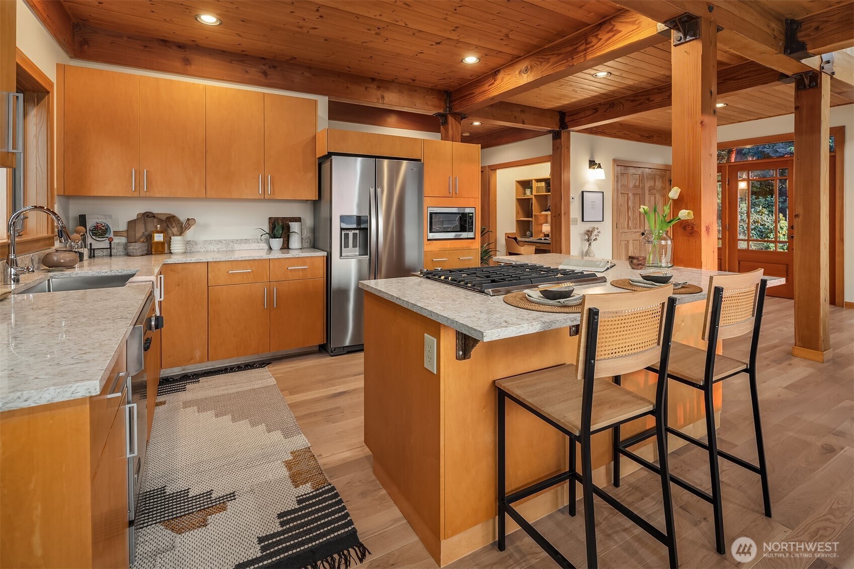 1002 Chuckanut Drive Bellingham, WA 98229 - Photo 10 of 40 a kitchen that has a table chairs in it and wooden floors