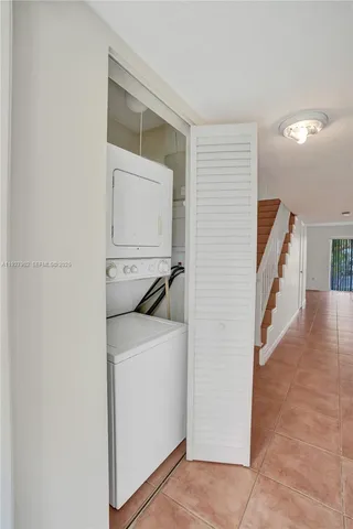 a view of a kitchen with cabinets and wooden floor