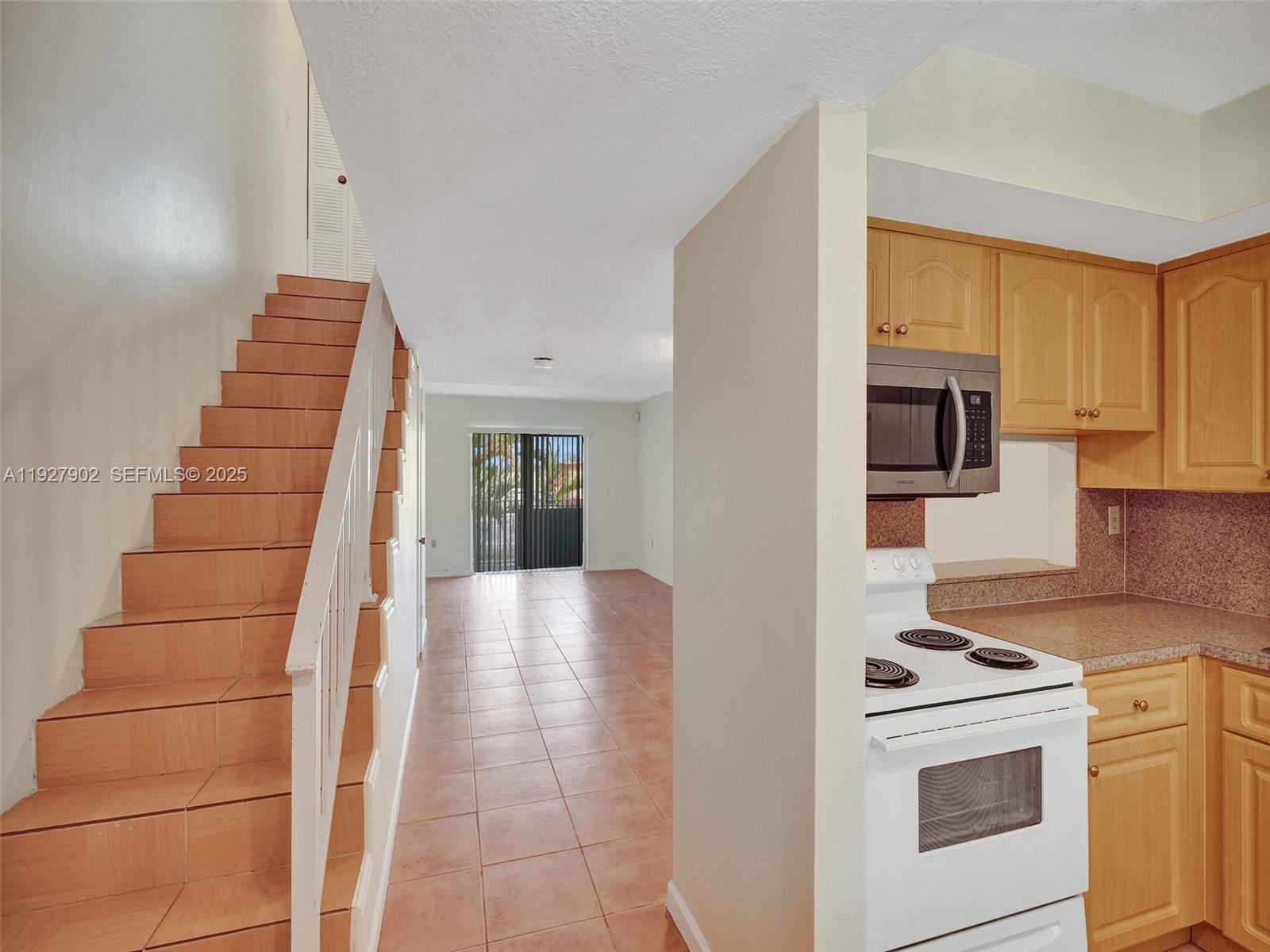4600 Southwest 67th Avenue, Unit 235 Miami, FL 33155 - Photo 16 of 40 a view of a kitchen with cabinets and wooden floor