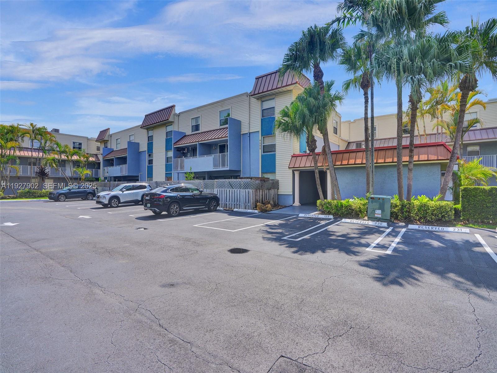 4600 Southwest 67th Avenue, Unit 235 Miami, FL 33155 - Photo 37 of 40 a city street lined with buildings and cars