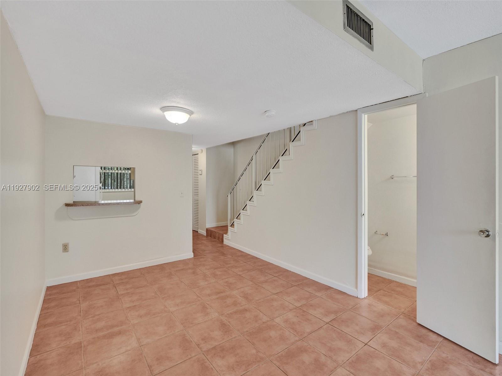 4600 Southwest 67th Avenue, Unit 235 Miami, FL 33155 - Photo 7 of 40 a view of an empty room with a window