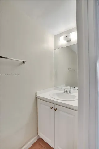 a white toilet sitting next to a shower