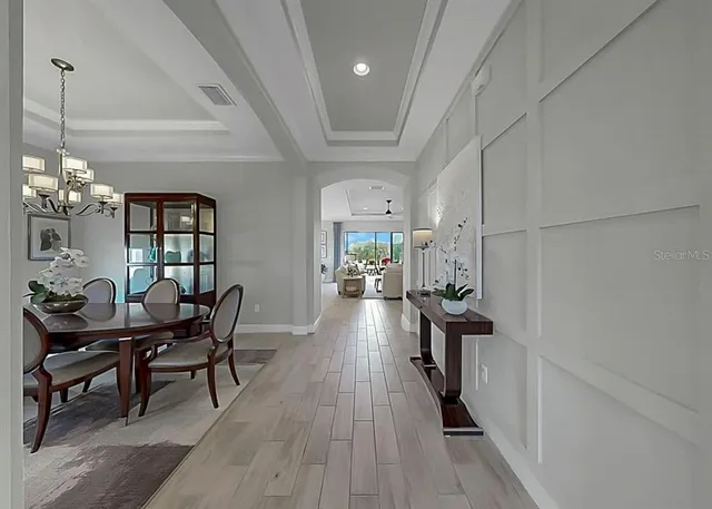 a kitchen with stainless steel appliances granite countertop a stove sink and cabinets