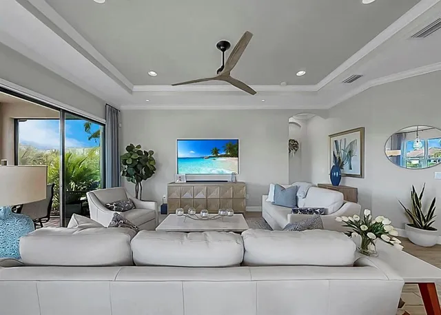a bedroom with a bed and ceiling fan