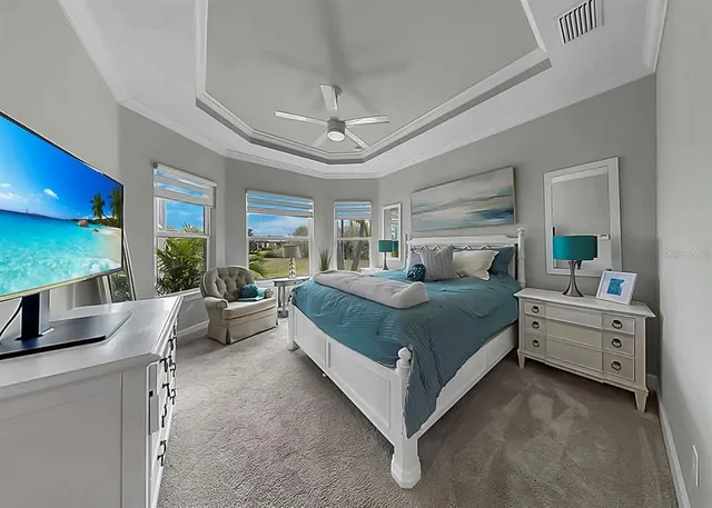 a spacious bedroom with a bed and a window