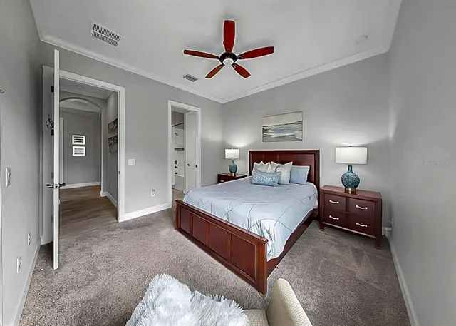 a bathroom with a sink mirror and toilet
