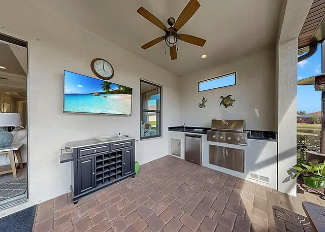 an aerial view of residential houses with outdoor space and trees