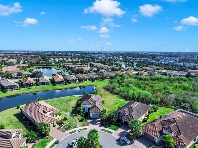 a view of a swimming pool with outdoor seating