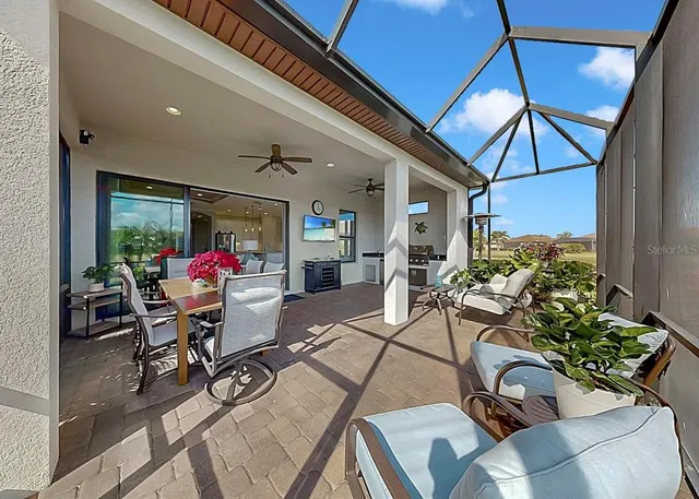 a outdoor living space with furniture and flowers