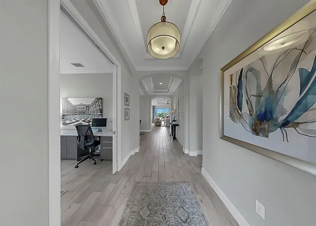 a bed room with furniture and a chandelier
