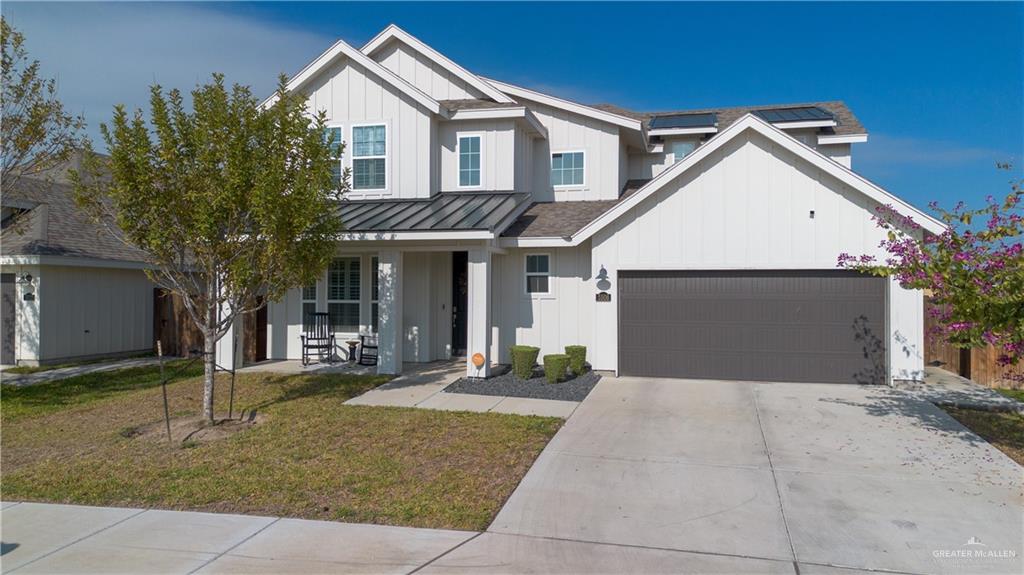 Modern Farmhouse with charming front porch, concrete driveway for extra parking.