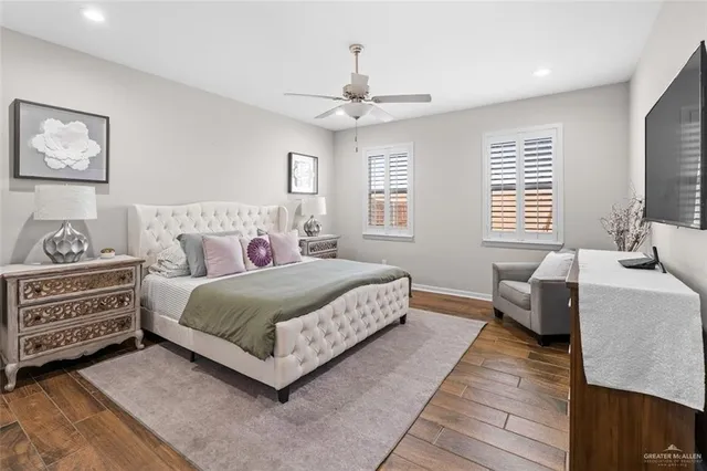 a view of a hallway with wooden floor and entryway