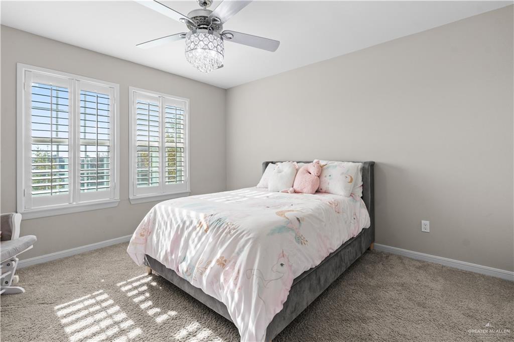5508 River Road McAllen, TX 78504 - Photo 13 of 21 Carpeted bedroom with baseboards and a ceiling fan