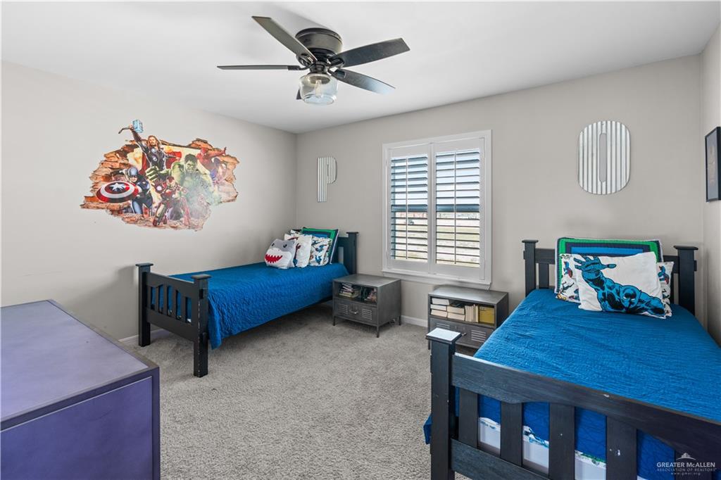 5508 River Road McAllen, TX 78504 - Photo 15 of 21 Bedroom featuring light colored carpet and ceiling fan