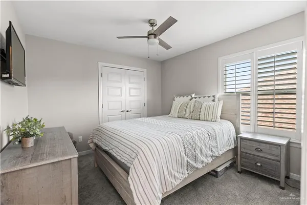 a bedroom with a bed and a table