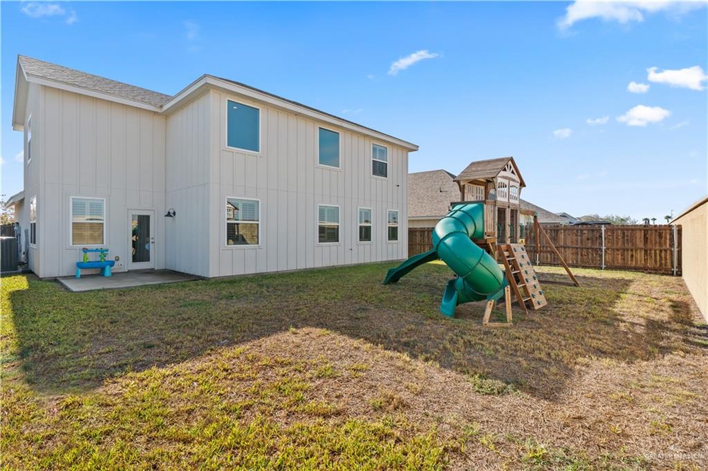 5508 River Road McAllen, TX 78504 - Photo 20 of 21 View of play area featuring a fenced backyard and a patio area