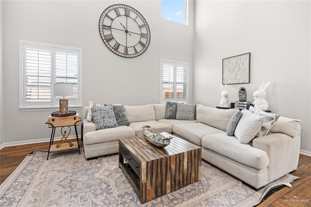 5508 River Road McAllen, TX 78504 - Photo 5 of 21 Living room with wood finished floors and a high ceiling