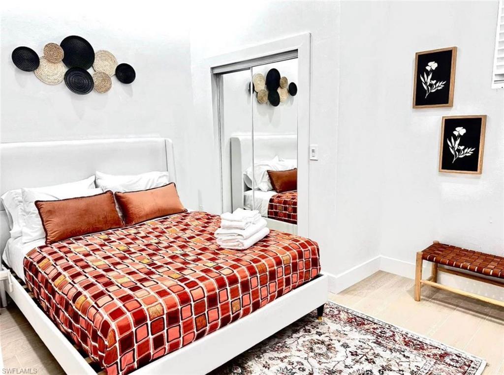 2881 Santa Barbara Boulevard Naples, FL 34116 - Photo 14 of 15 Bedroom with a closet and baseboards