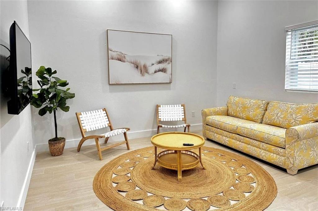 2881 Santa Barbara Boulevard Naples, FL 34116 - Photo 3 of 15 Living area featuring baseboards