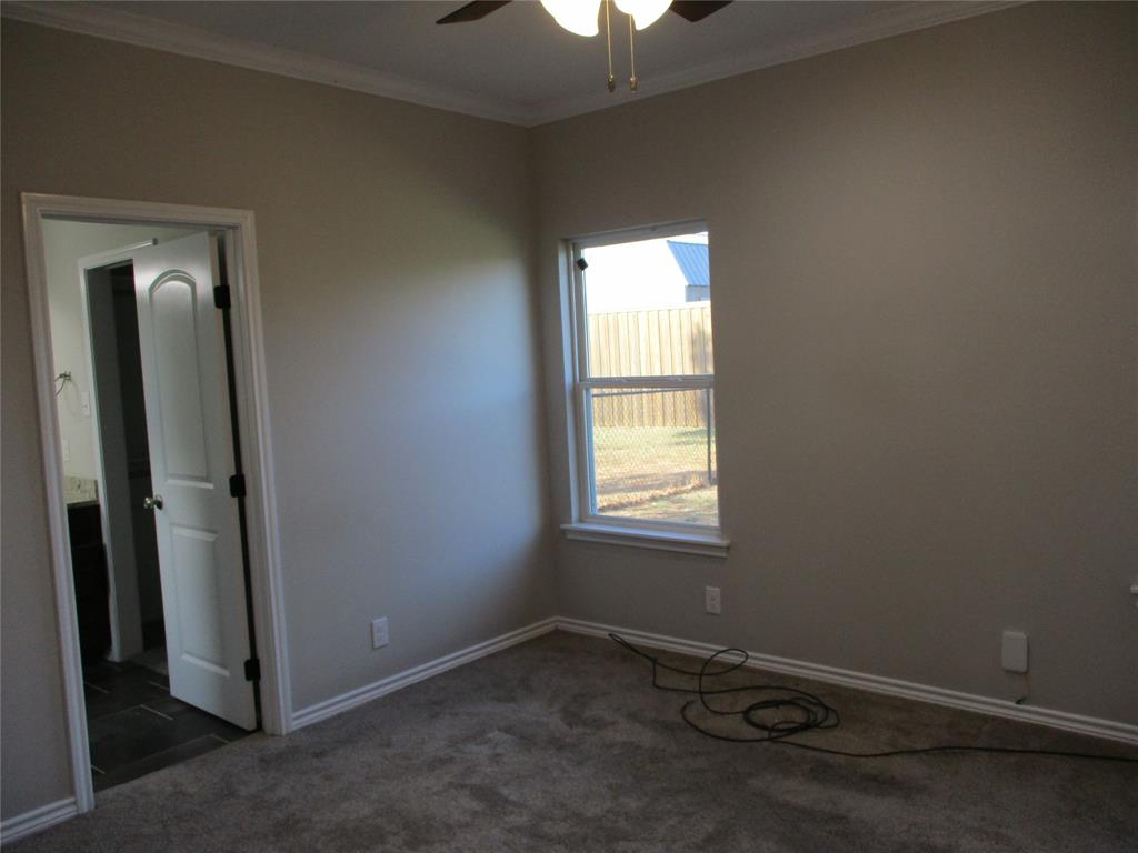 207 Mill Street Emory, TX 75440 - Photo 18 of 34 an empty room with a window