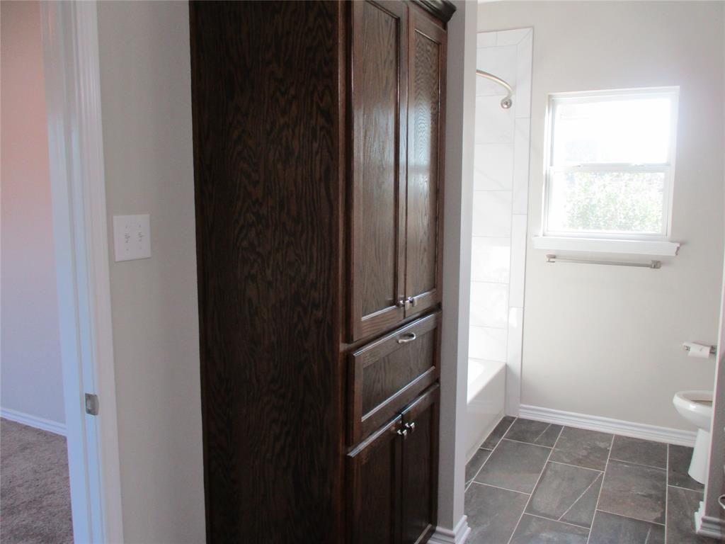207 Mill Street Emory, TX 75440 - Photo 24 of 34 a view of a kitchen from the hallway