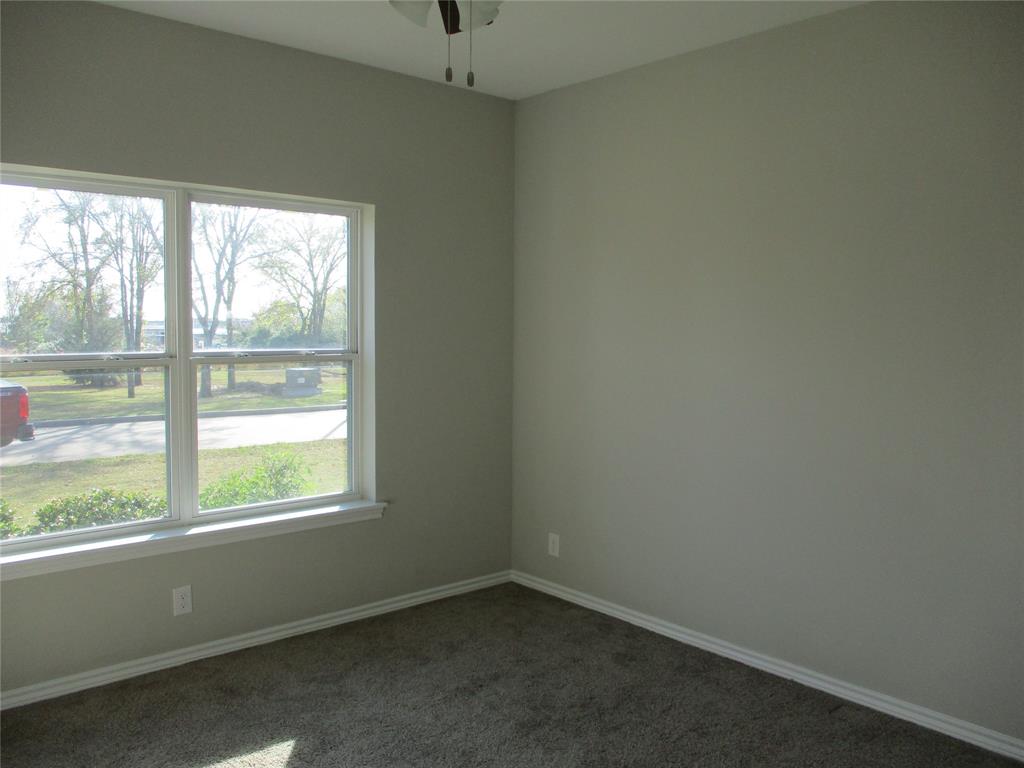 207 Mill Street Emory, TX 75440 - Photo 29 of 34 an empty room with a window