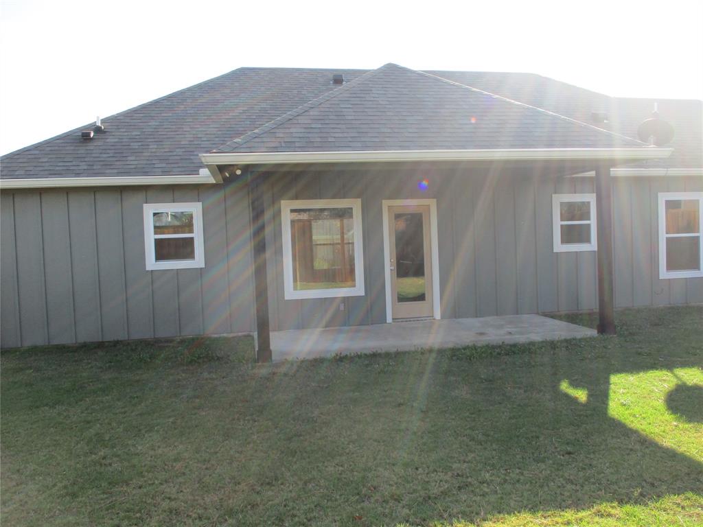 207 Mill Street Emory, TX 75440 - Photo 3 of 34 a view of an house with backyard space and garden