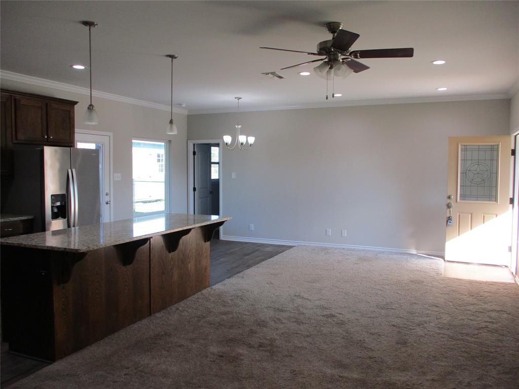 207 Mill Street Emory, TX 75440 - Photo 33 of 34 a view of a kitchen with a sink and refrigerator