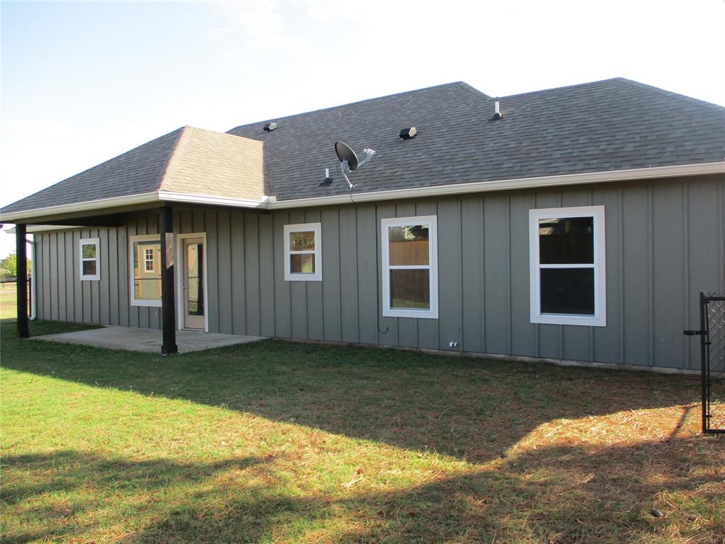 207 Mill Street Emory, TX 75440 - Photo 4 of 34 a front view of a house with a yard